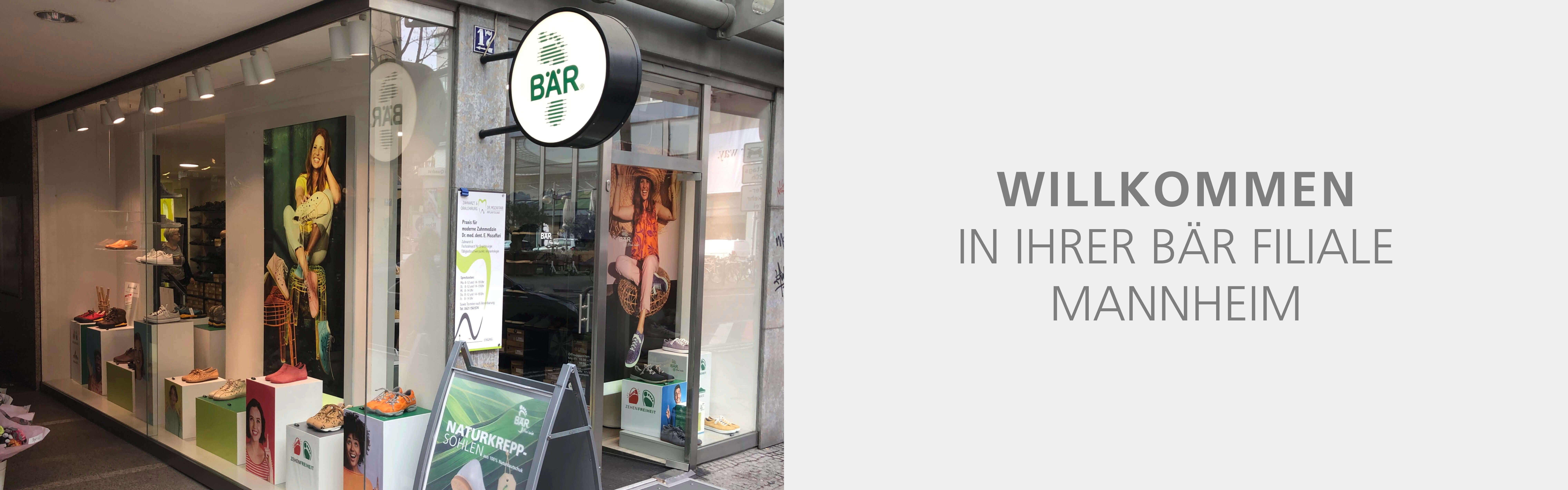 Exterior view of the BÄR Shoes store in Mannheim featuring shoe displays and welcome signage.