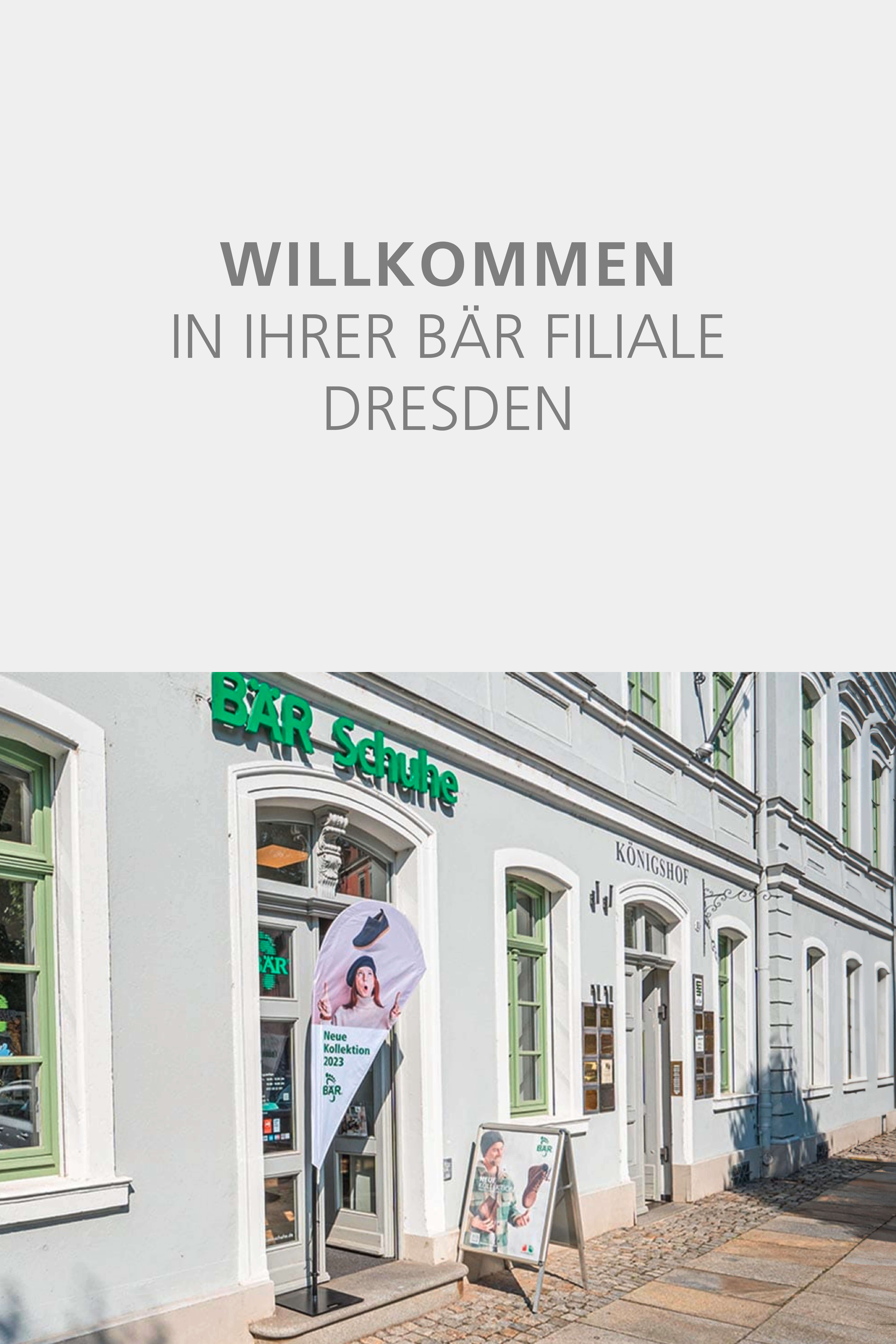 Entrance of BÄR shoe store in Dresden with promotional flags and signs