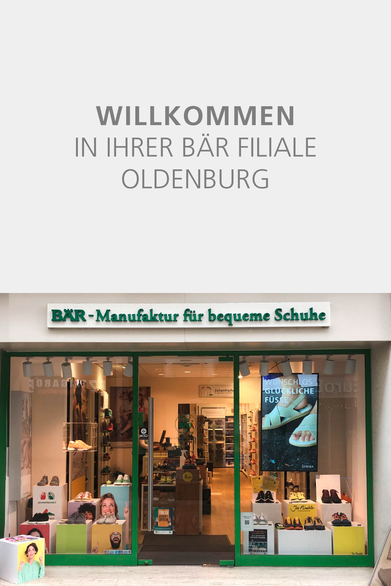 Entrance of BÄR shoe store in Oldenburg with display of comfortable shoes.