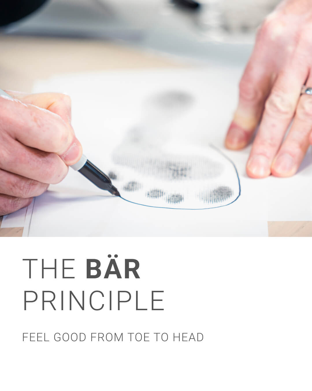 Close-up of hands drawing a foot outline with the words 'The BÄR Principle - Feel Good from Toe to Head'.