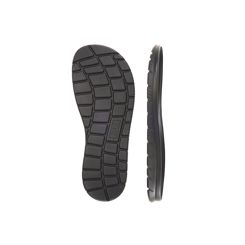 Shoe sole made of durable black rubber, showing a grid tread pattern, displayed from top and side angles.
