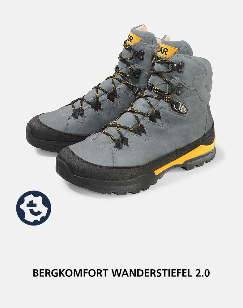 Pair of grey and yellow Bergkomfort Hiking Boots 2.0 with sturdy design and robust laces, ideal for outdoor adventures.