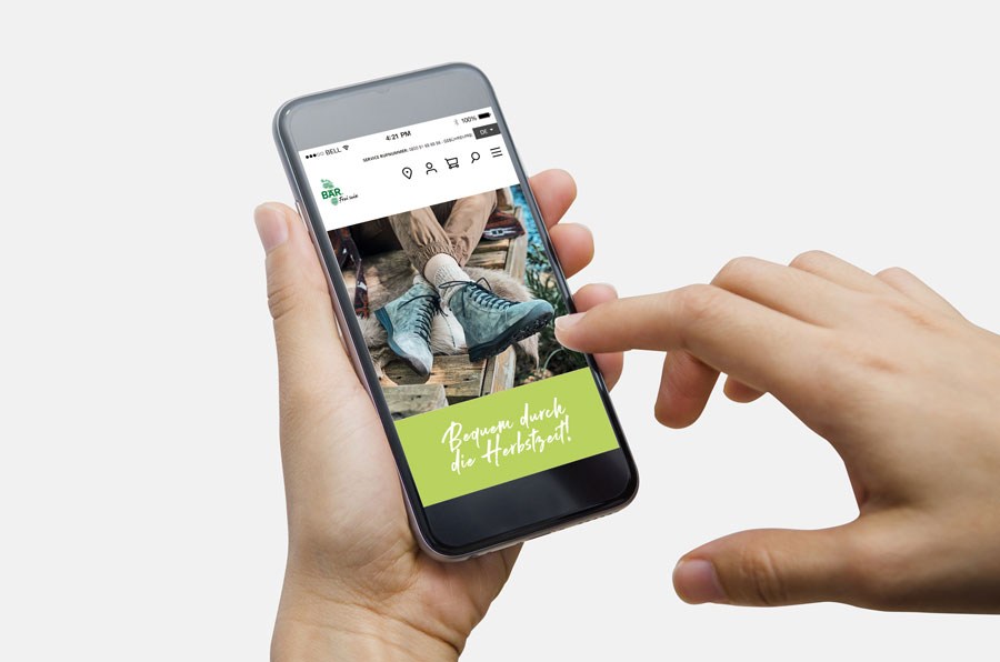 Person browsing fall shoe collection on smartphone