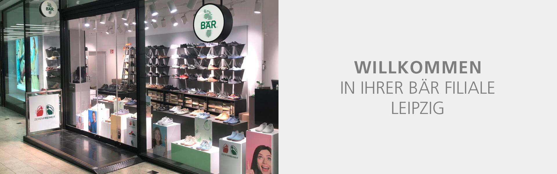 Entrance of BÄR shoe store in Leipzig showcasing various footwear on display with a welcome sign.