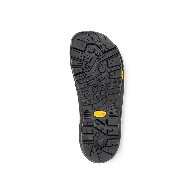 Close-up of a black hiking boot sole featuring a detailed tread design for enhanced grip and traction.