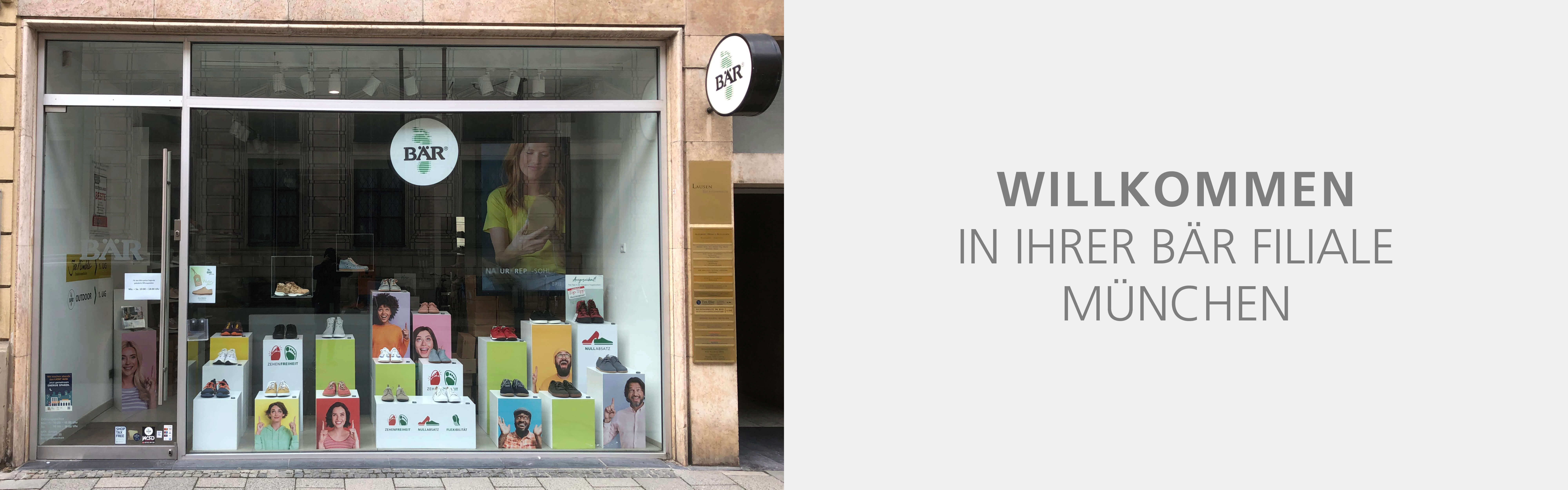 Window display of BÄR Shoe Store showcasing shoes and promotional images in Munich