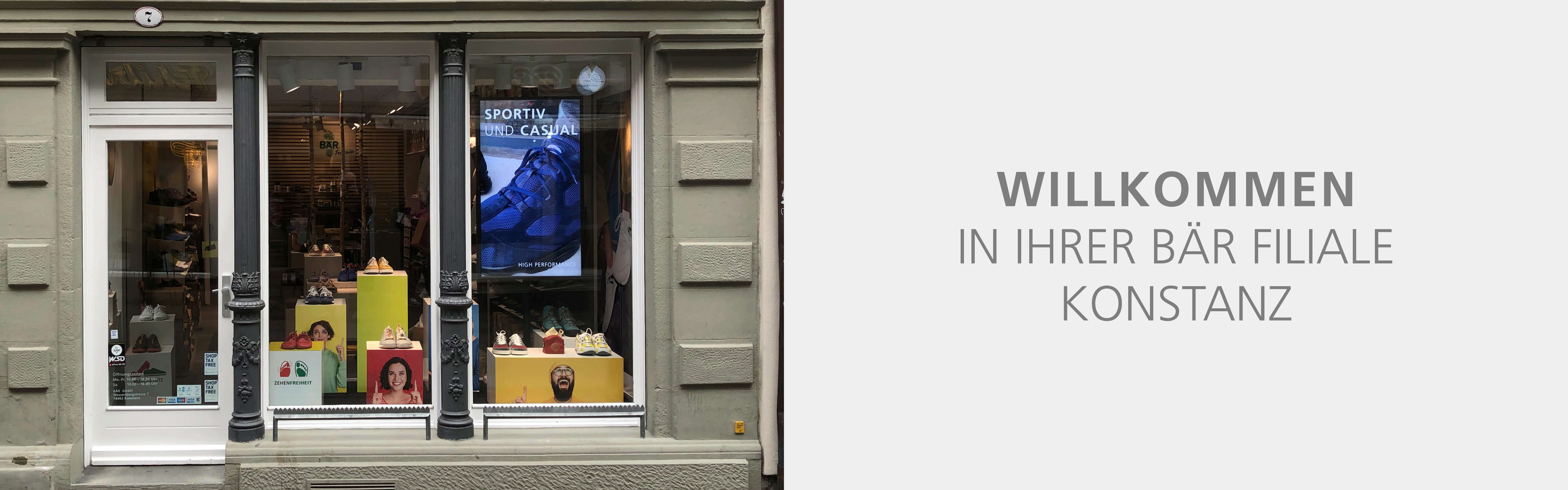 Entrance of Bär Footwear store in Konstanz featuring a window display with shoes and a welcome sign.