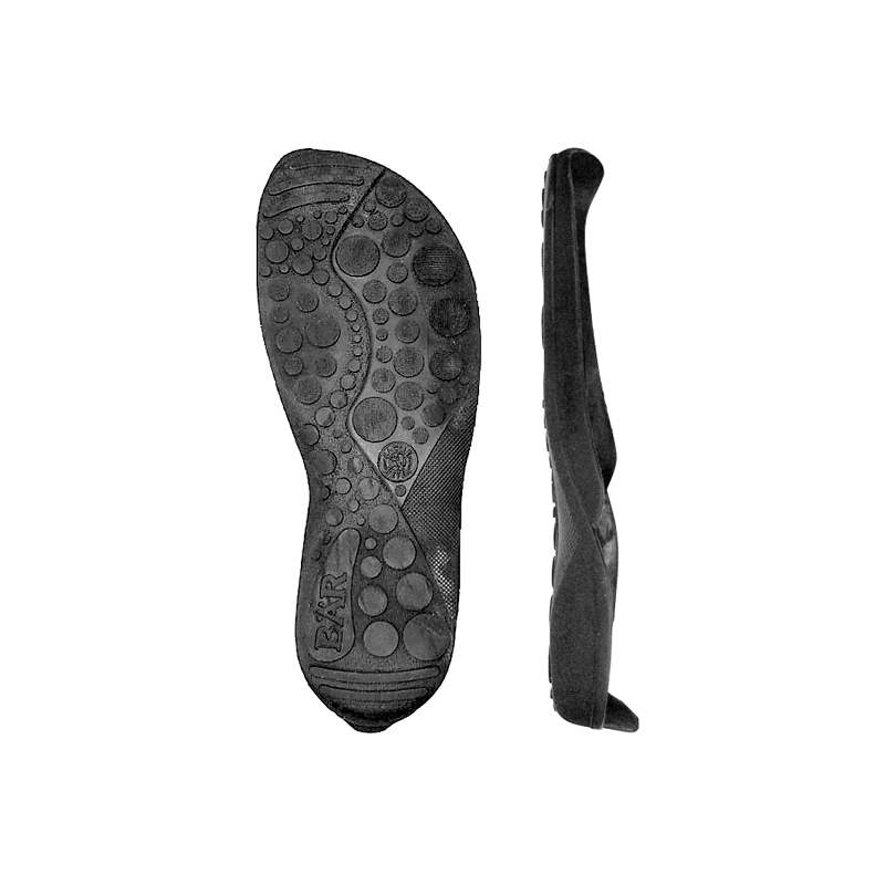 Black shoe soles with textured pattern and BÄR logo for enhanced grip