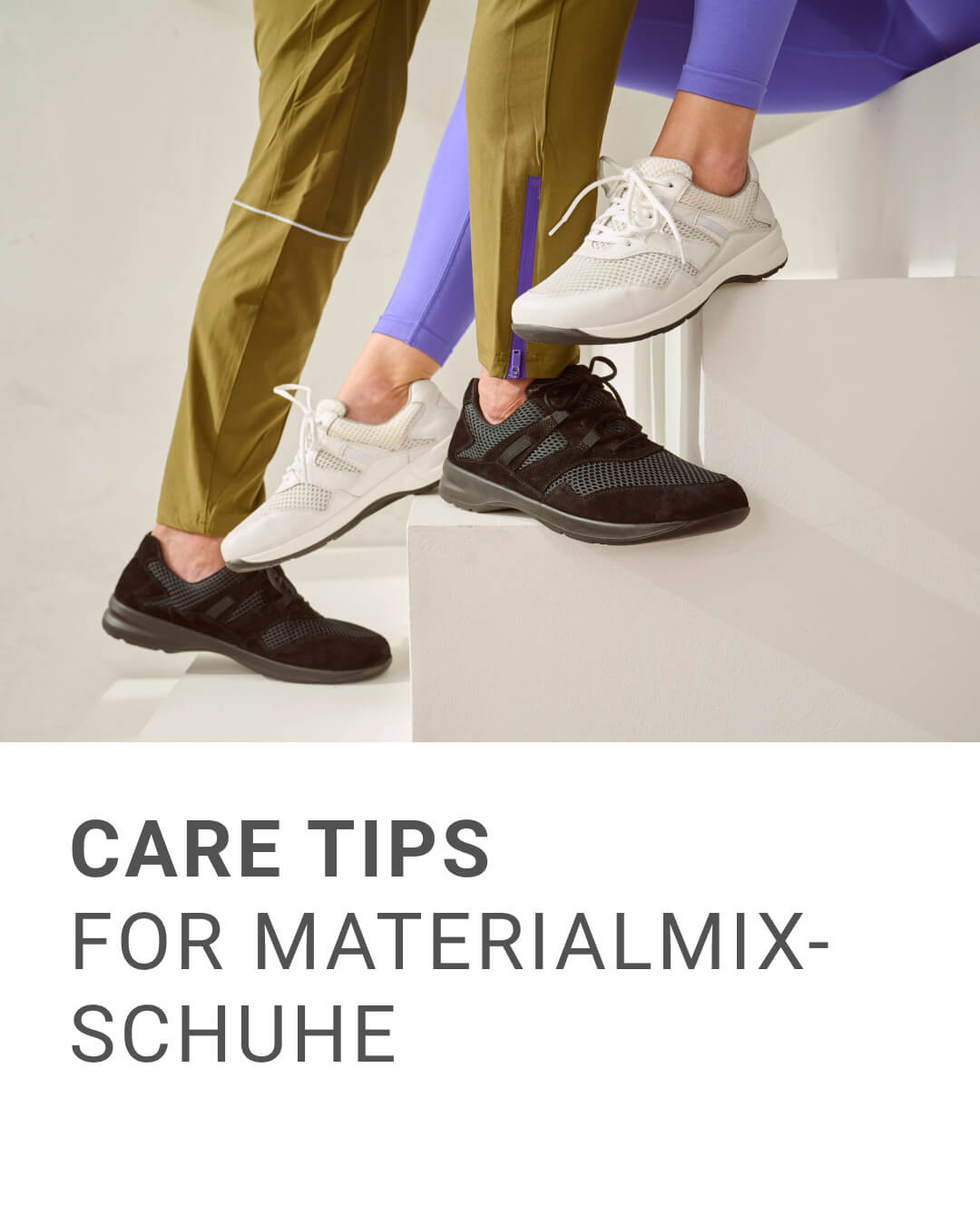 Two people wearing white and black material-mix sneakers on stairs