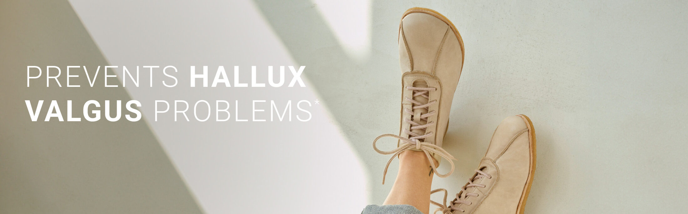 Person wearing beige shoes that help prevent hallux valgus